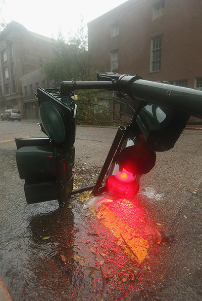 Isaac update: A downed streetlight lies in the rain in New Orleans