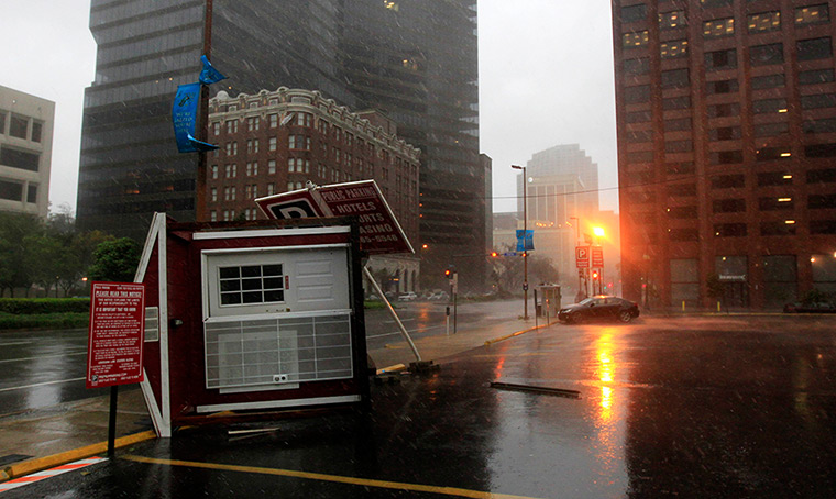 Isaac update: A parking attendant booth is overturned on Poydras St. downtown New Orleans