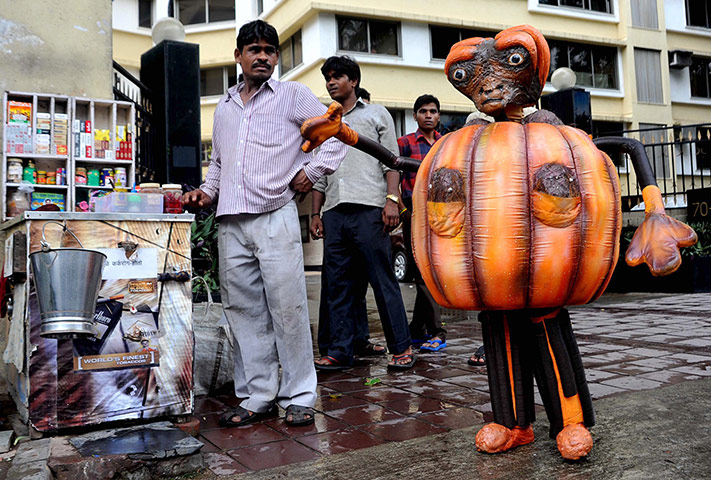 Week in Film: A performer dressed as an alien