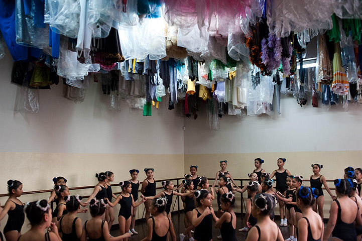 24 hours in pictures: Girls participate in a ballet class at the Metropolitan Culture Centre