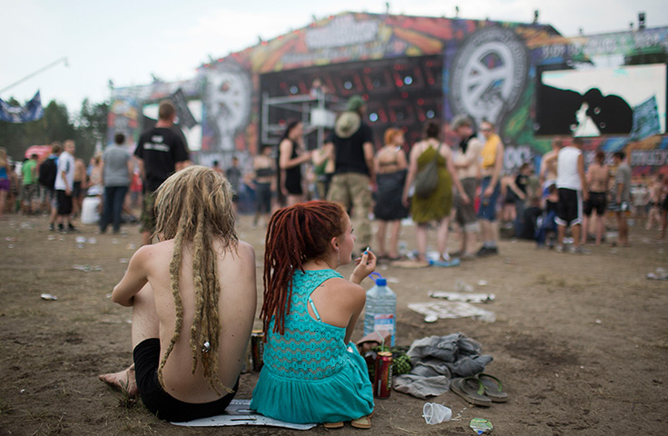 24 hours in pictures: A couple sits in front of the main stage Prznek Woodstock