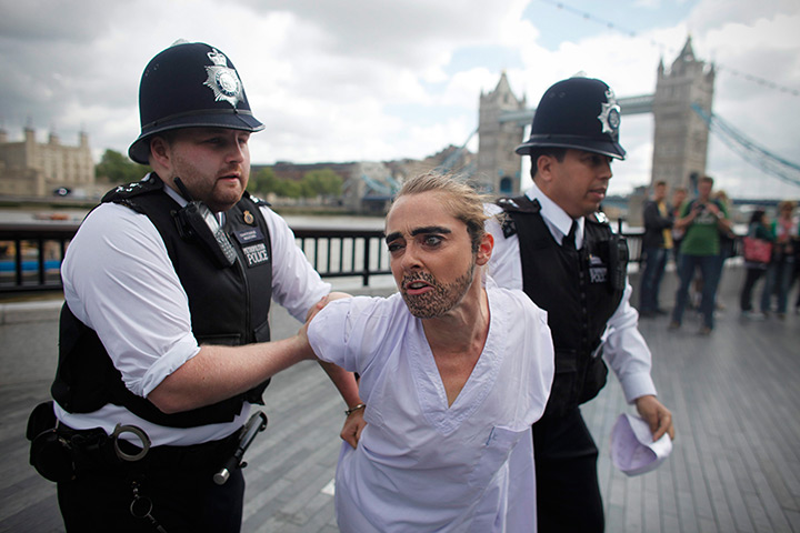 24 hours in pictures: policemen arrest activists of the feminist group FEMEN during their protest