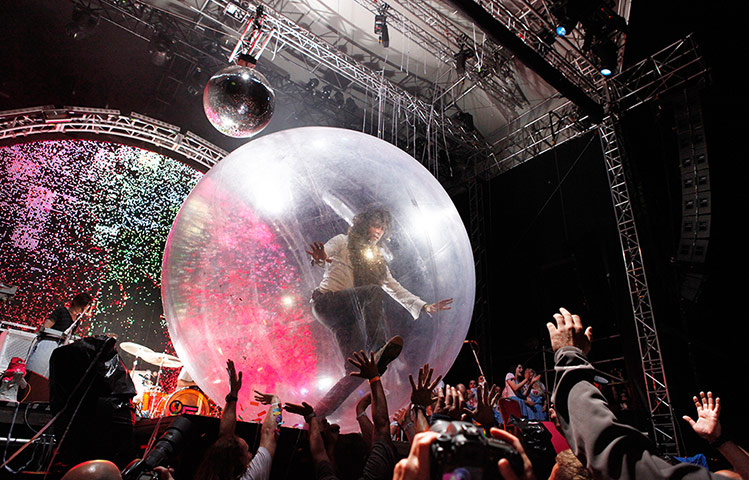 Week in music: Wayne Coyne of the The Flaming Lips crowd surfs in an orb