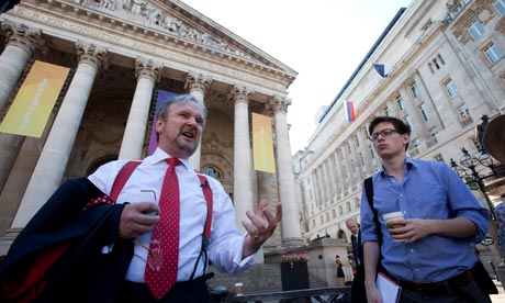 Pay attention … Meltzer listens to Justin Urquhart Stewart outside The Royal Exchange.