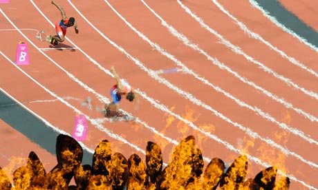 Competitors race behind the Olympic flame on the first of day of the athletics events