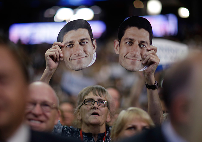 Republican convention: A delegate holds up a mask of Paul Ryan