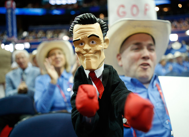 Republican convention: Texas delegate Patrick O'Daniel holds a fighting doll of Mitt Romney