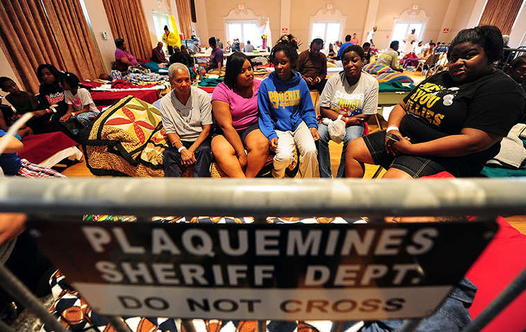 Hurricane Isaac: Storm residents take refuge at a high school auditorium in Belle Chasse