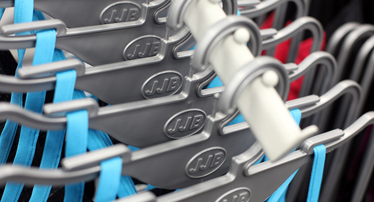 Week in Business: Sports clothing is displayed on hangers at a JJB store