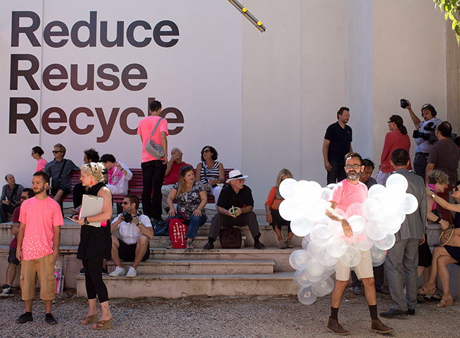 Venice architecture: A man weas a balloon dress outside the German pavilion