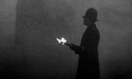 Police using flames at Marble Arch to direct the traffic in London smog 1952