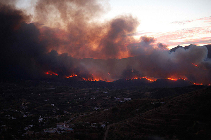 fires on costa del sol: The fire burns near residential properties  at Barranco Blanco near Malaga