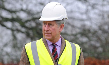 Prince Charles views work on a property bought by the Duchy of Cornwall