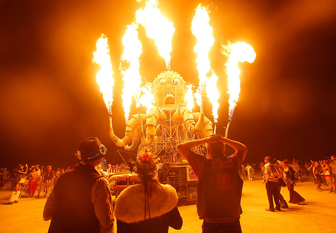 Week in music: Festival-goers watch the flames from El Pulpo Mecanico
