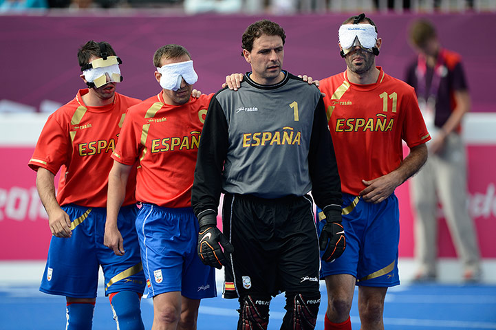 blind football: The spanish players are led back onto the pitch for the second half 