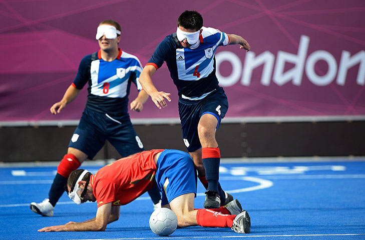 blind football: GB player Keryn Seal leaps over a Spanish defender
