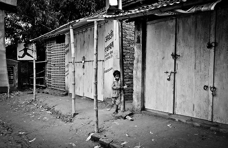 Child Slaves: A child stands by the roadside in Bihar state, India