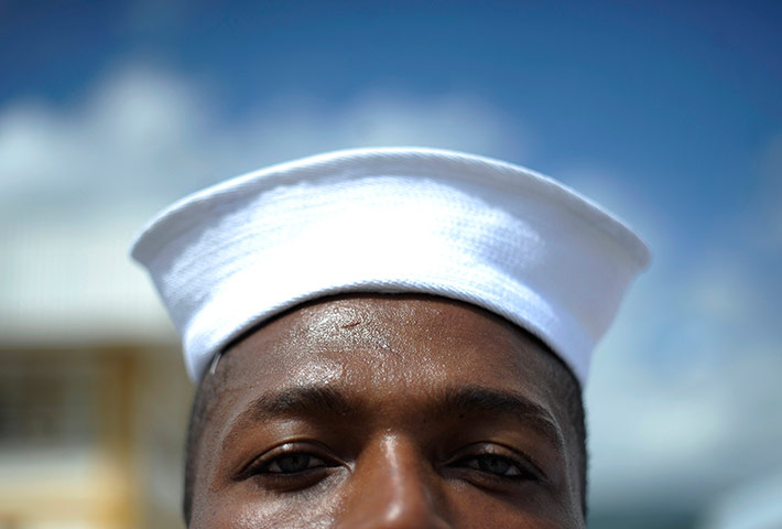 24 hours: A member of the Honduran navy stands at attention