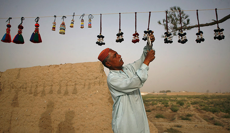 24 hours: A man hangs decorations in Quetta, Pakistan