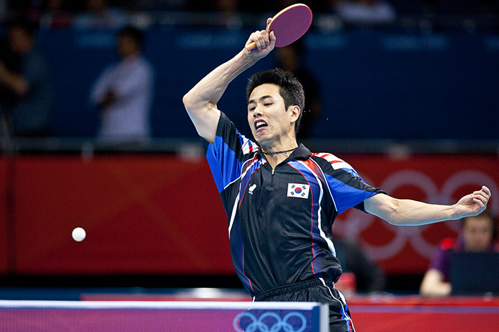 Table tennis: Saehyuk Joo of South Korea returns to Song Man Jang of North Korea