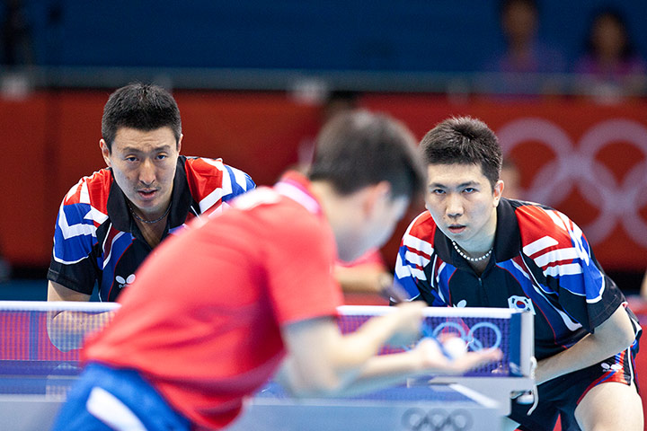 Table tennis: South Korea's S Oh & S Ryu. Korea look determined to return this serve