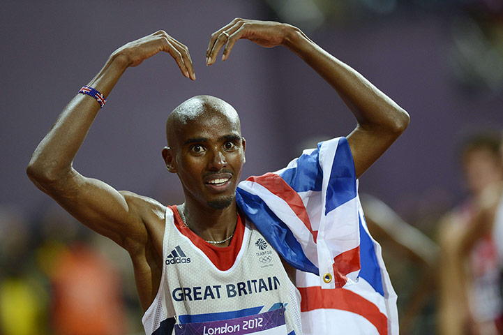 Mo Farah: Mo celebrates with his arms raised in a Mo sign after winning the race