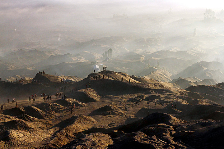 Mount Bromo: Indonesian villagers walk to the crater at Mount Bromo