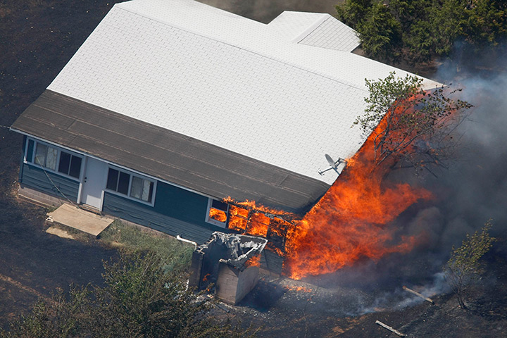 Oklahoma wildfires: A house is engulfed in flames east of Drumright