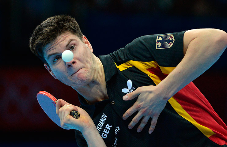 London 2012 Table Tennis: Dimitrij Ovtcharov eyes the ball before returning a shot to Michael Maze