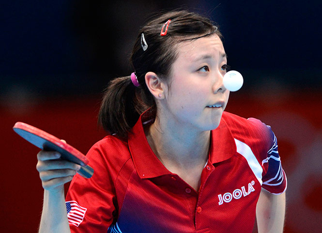 London 2012 Table Tennis: Ariel Hsing, 16 of the USA serves to No. 2 seed Xiaoxia Li