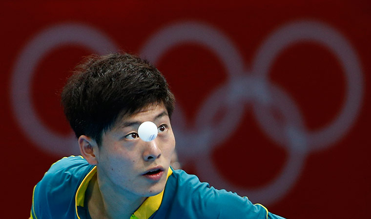 London 2012 Table Tennis: Justin Han serves against Mawussi Agbetoglo during their table tennis match