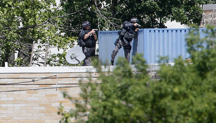 Sikh Temple Shooting USA: Armed police investigate the Sikh Temple in Oak Creek, Wisconsin 