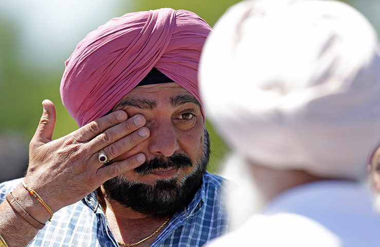 Sikh Temple Shooting USA: A man wipes away tears outside the Sikh Temple