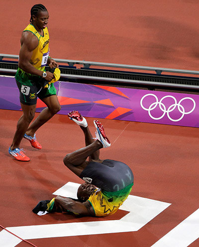 Bolt's Ticks: Bolt performs a somersault as he celebrates gold medal