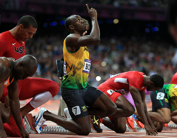 Bolt's Ticks: Bolt points to the sky at the start of the 100m final