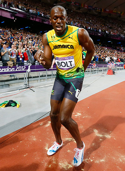 Bolt's Ticks: Usain Bolt of Jamaica celebrates winning the men's 100m final