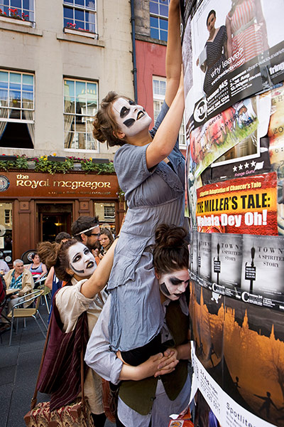 Royal Mile: The cast from Oedipus The Hour pin up posters for their show