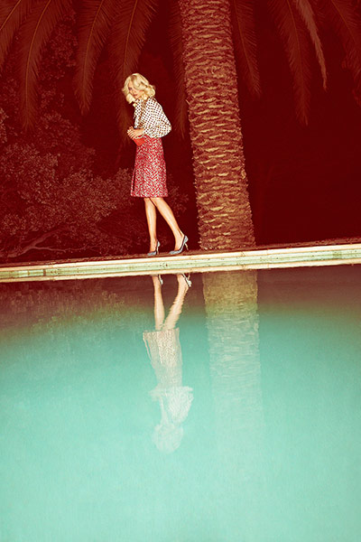 Fashion: Summer Evening: Model wearing black and white polka dot blouse and red lurex jacquard skirt