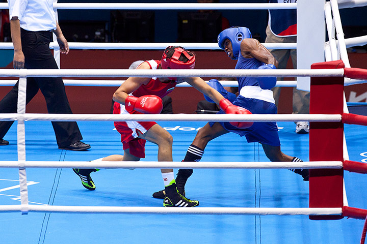 Women's boxing: Britain's Nicola Adams evades a left from Bulgaria's Stoyka Petrova