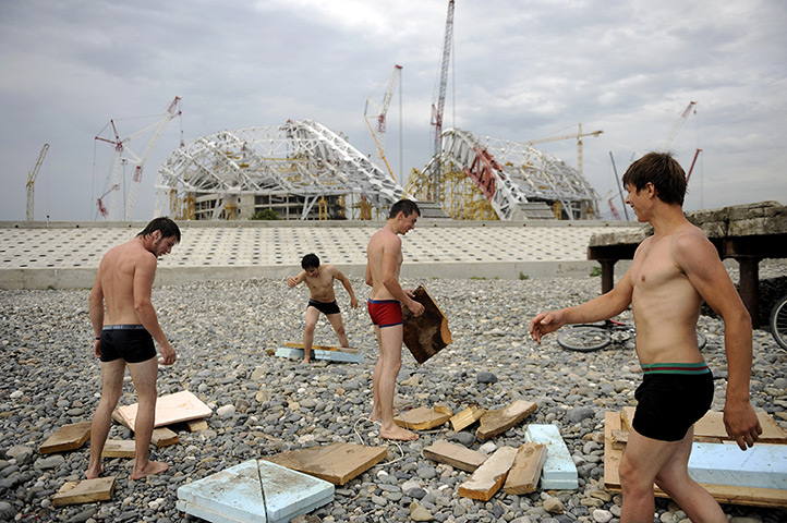 24 hours in pictures: Workers take a break in front of the 
