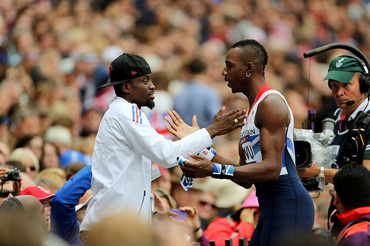 Graeme Athletics gallery: Phillips Idowu is consoled after failing to make the triple jump final