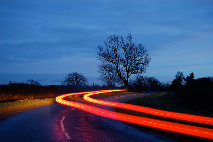 Your Pictures: Getaways: Blurred light of a car on road