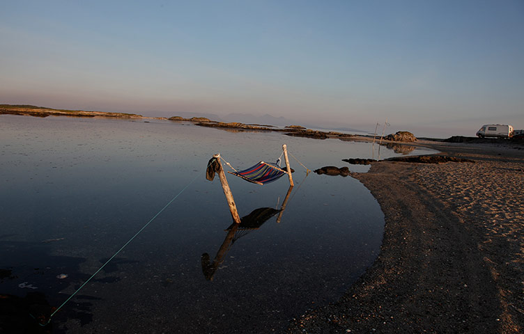 Your Pictures: Getaways: Deckchair in the water on a beach