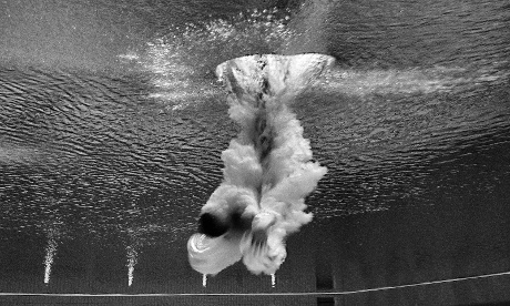 Brazilian diver Cesar Castro entering the water in the 3m springboard qualifier