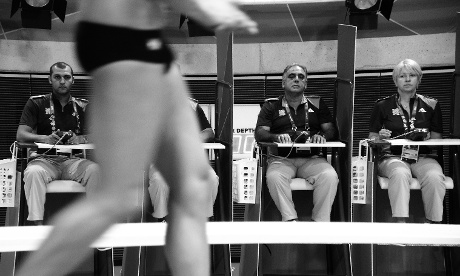 These judges at the men's 3m springboard are charged with assessing the divers.