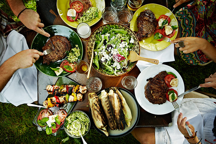 Brita - barbecues: Aerial view of friends dining at table outdoors