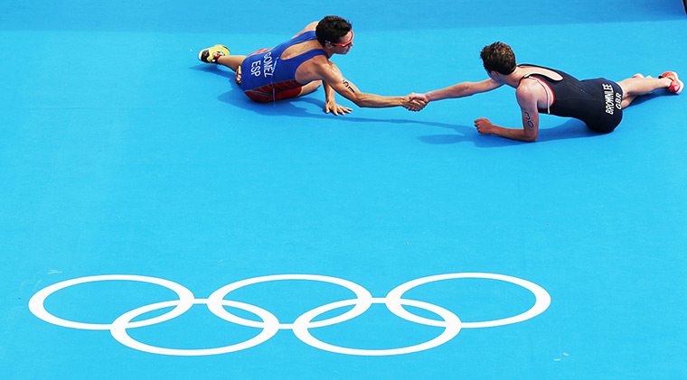 Winners and losers: listair Brownlee shakes hands with Spain's Javier Gomez at Triathlon