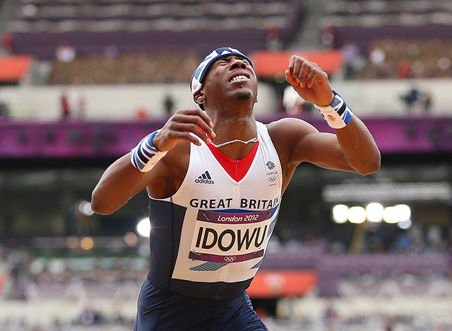 Winners and losers: Phillips Idowu looks dejected at men's triple jump qualification