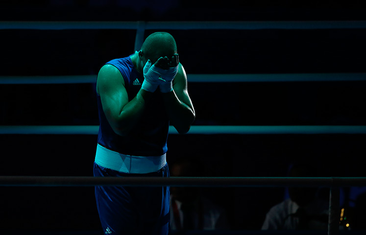 Winners and losers: Siarhei Karneyeu of Belarus reacts after his fight
