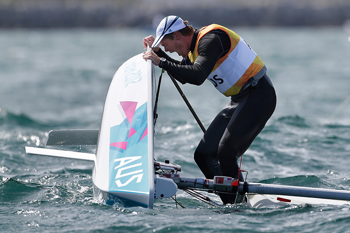 Winners and losers: Australia's Tom Slingsby celebrates after winning the gold medal 